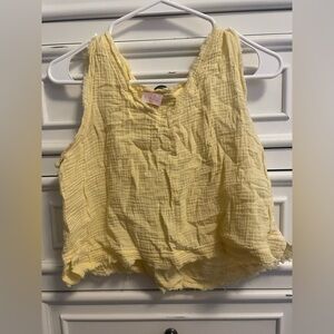 **Buy 4 Get 1 Free. $5 items only!** Pink Lily Yellow Smocked Crop Tank Top